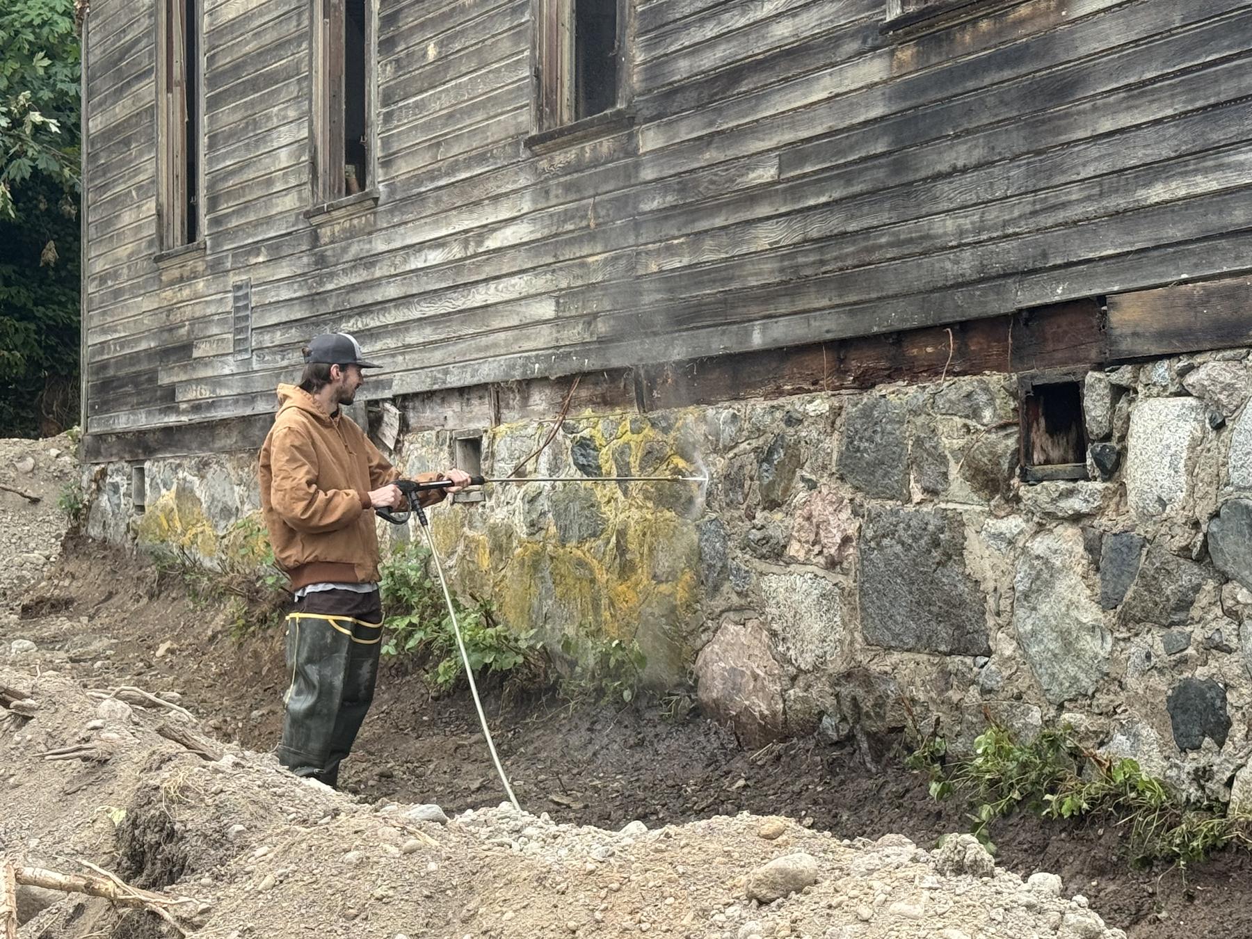 Pressure washing the foundation